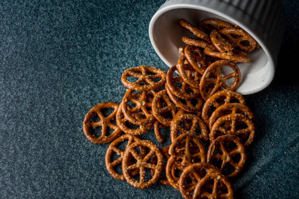 istock Salty pretzels poured out from the bowl  with copy space 1465228751