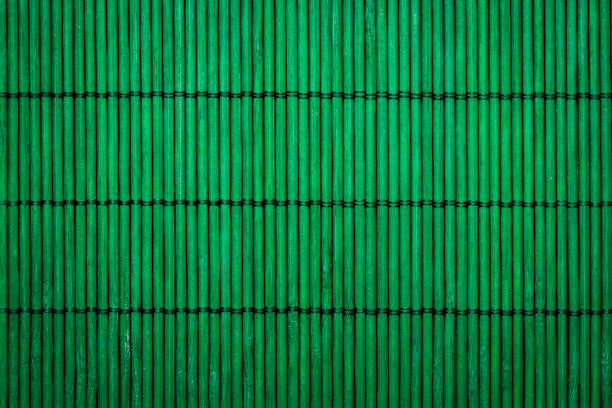 istock Closeup shot of a green surface with bamboo cane textures 1465228799