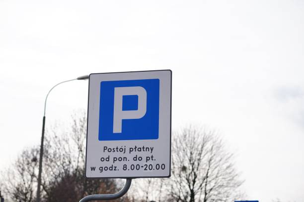 istock Blue road sign in Polish against the sky and leafless trees 1465229637