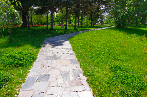 Winding footpath in the city park in astrakhan.