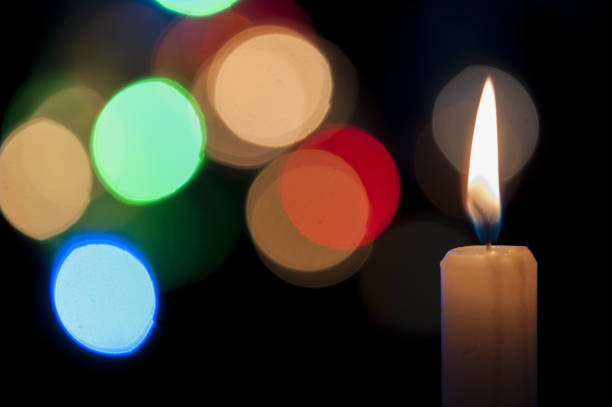 istock Burning candle with bokeh background 1465235279