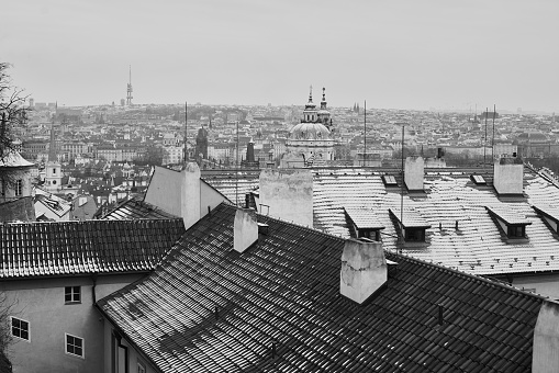 Snow covered roof tops in historical old town in Prag