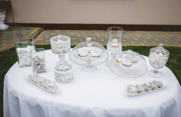 istock Table with cupcakes and cookies for wedding celebration 1465243345