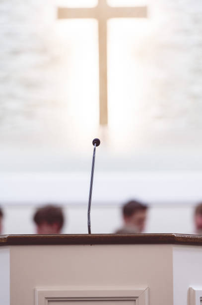 istock Microphone on a rostrum in a church 1465243708