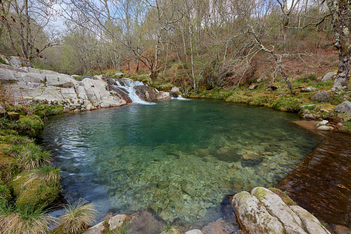 a natural pool formed in the rocks by the Cerves river in Galicia, Spain