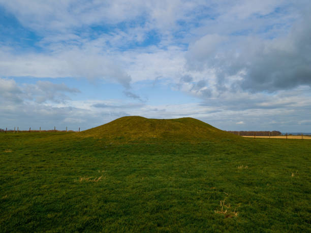 istock Large  burial mound under a cloudy sky in Weymouth, Dorset, UK 1465245605