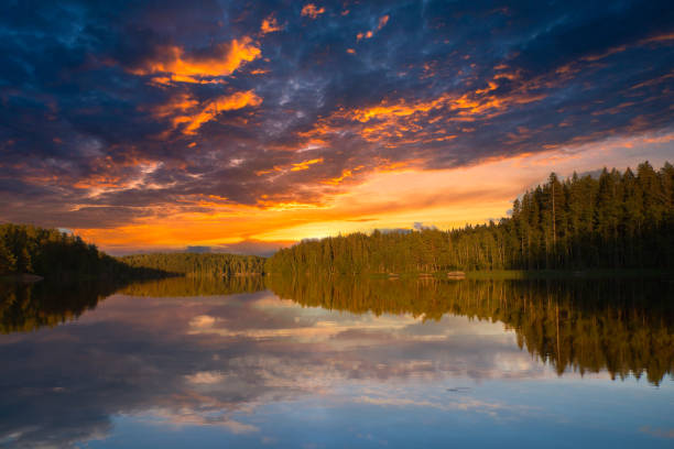 istock Mesmerizing sunset view over the scenic lake and forest reflecting on the water surface 1465245787
