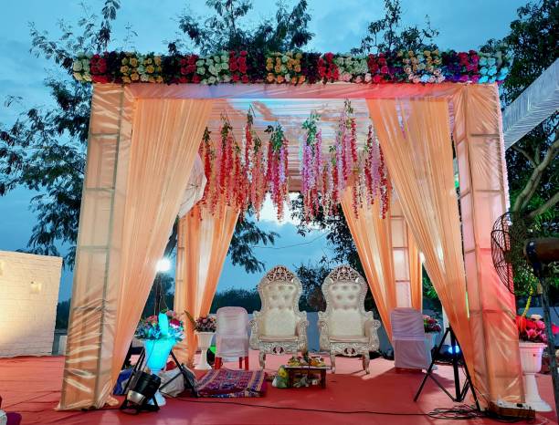 istock India Wedding event stage decorated with flower, chair, light 1465246213