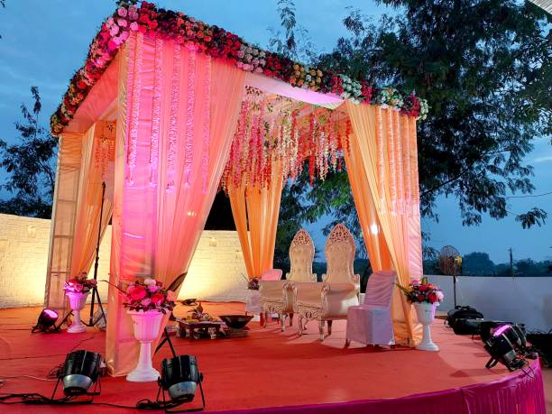 istock India Wedding event stage decorated with flower, chair, light 1465246219