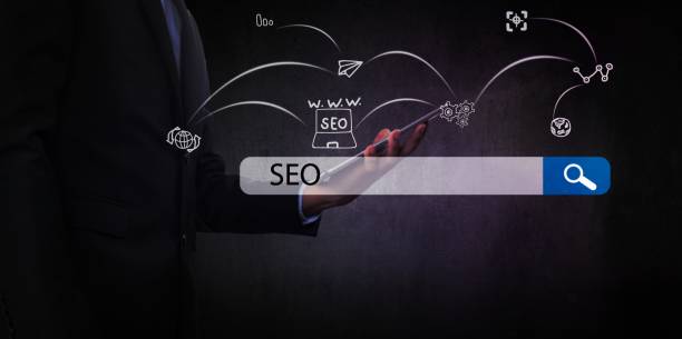 istock Searching Engine Optimizing SEO Browsing Concept, Businessman holding phone for looking information with technology and internet icon. 1465246579