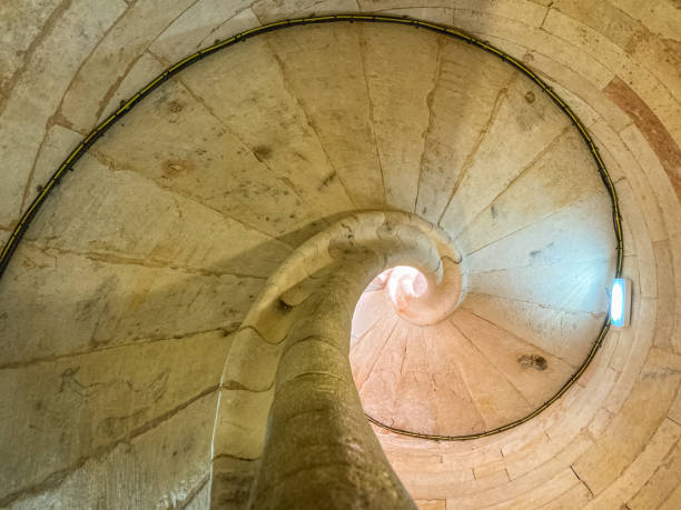 istock Closeup of spiral staircase with sunlight 1465246909