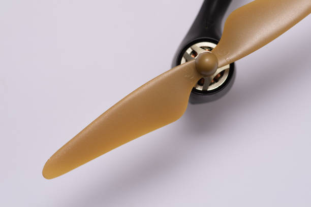 istock Closeup of a brown drone propeller isolated on white background 1465247026