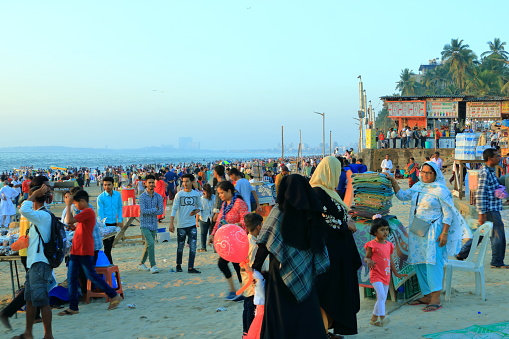 December 20 2022 - Mumbai, Maharashtra in India: people enjoy the evening on Juhu Beach