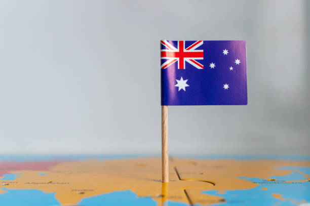 istock Closeup of a small autralian flag on a world map puzzle 1465249242