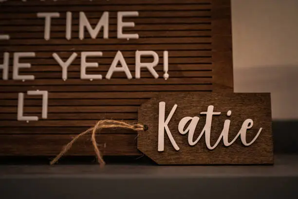 A wooden Christmas ornament with the name "Katie"