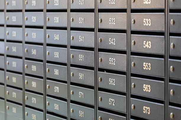 istock Mailboxes for letters and correspondence. Modern mailboxes with numbers in the lobby of a residential or office building close-up. 1465251341