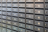 Mailboxes for letters and correspondence. Modern mailboxes with numbers in the lobby of a residential or office building close-up.