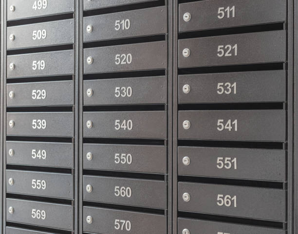 istock Mailboxes for letters and correspondence. Modern mailboxes with numbers in the lobby of a residential or office building close-up. 1465251347