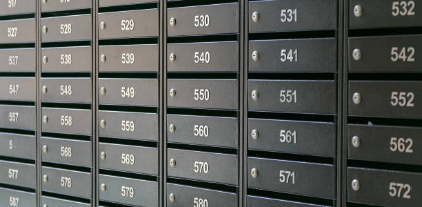 istock Mailboxes for letters and correspondence. Modern mailboxes with numbers in the lobby of a residential or office building close-up. 1465251413