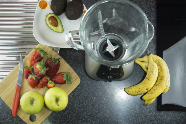 istock Top view of fresh fruit and a blender on a kitchen marble counter 1465252071