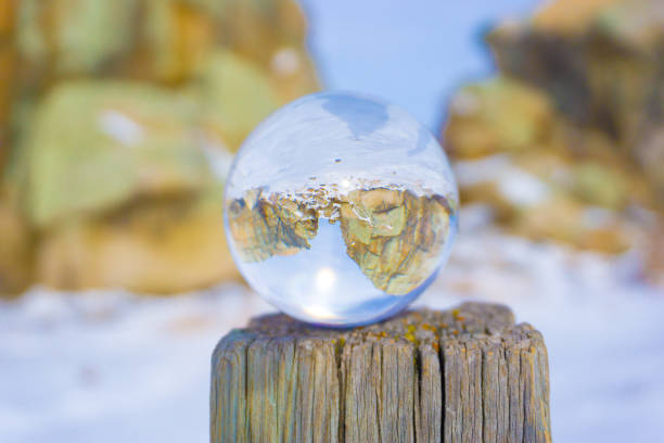 istock Crystal ball on a stump reflecting the rocky mountains 1465252139