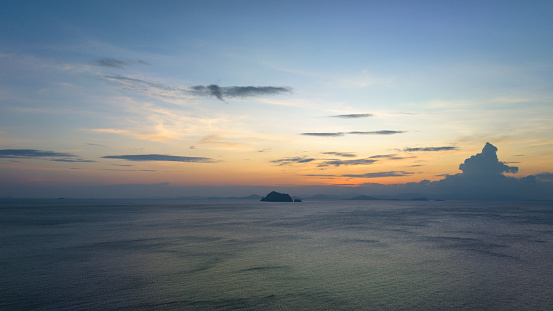 Colorful moody Sunset and Cloudscape over the Andaman Sea. Koh Yao Yai Phang Nga Bay Sunset. Aerial Drone Point of View Panorama. Ko Yao Yai is a Thai island in the Andaman Sea, halfway between Phuket and Krabi. Ko Yao Yai Island, Phang Nga Bay, Phuket, Thailand, Southeast Asia.