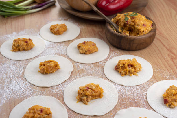 istock Ingredients for making Argentinian empanadas stuffed with vegetables and squash on wooden surface 1465252215
