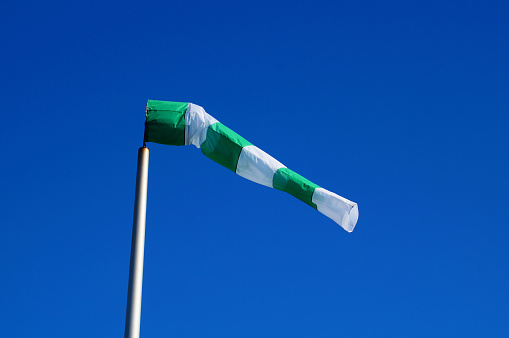Symbolically, windsocks at the former Frankfurt-Bonames airfield are a reminder of flight operations. Here a green-white one.