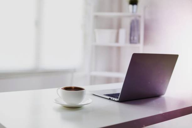 istock white and clear office room with laptop and coffee on table 1465255274