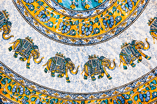 A closeup shot of beautiful Indian carpet decorated with elephants