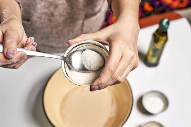istock Person making dough with yeast in a pot for a dish 1465256079