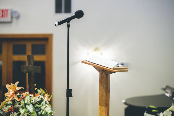 istock Microphone and a tribune for speech on a stage 1465257743