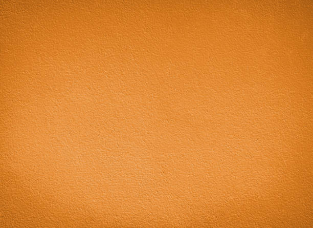 Ochre Color Texture Background - Grainy Ochre Color Wall stock photo