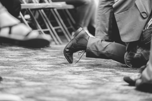 istock Man praying in a church while kneeling 1465260525