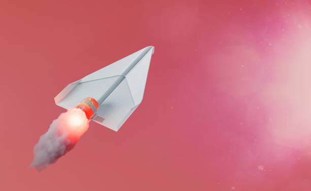 istock paper airplane with propeller releasing fire 1465262323