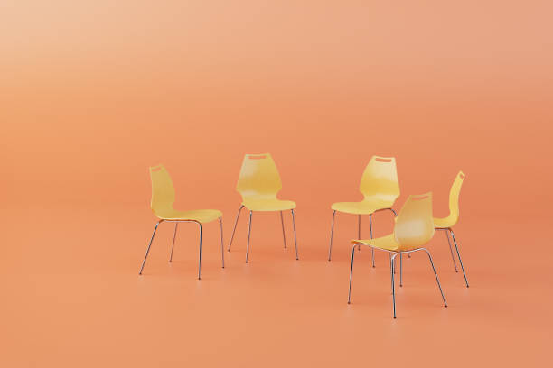 istock yellow plastic chairs arranged in a circle on a pastel background. 3D render 1465265255