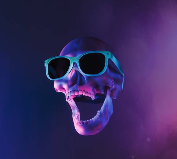 skull with neon lighting and sunglasses stock photo