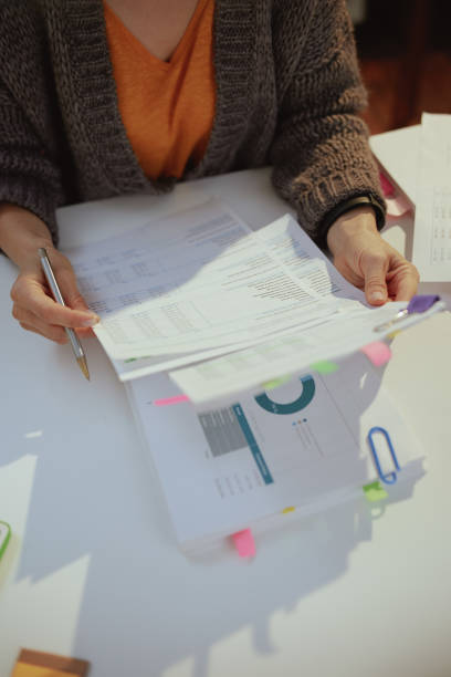 istock tax time. accountant woman working with documents 1465271563