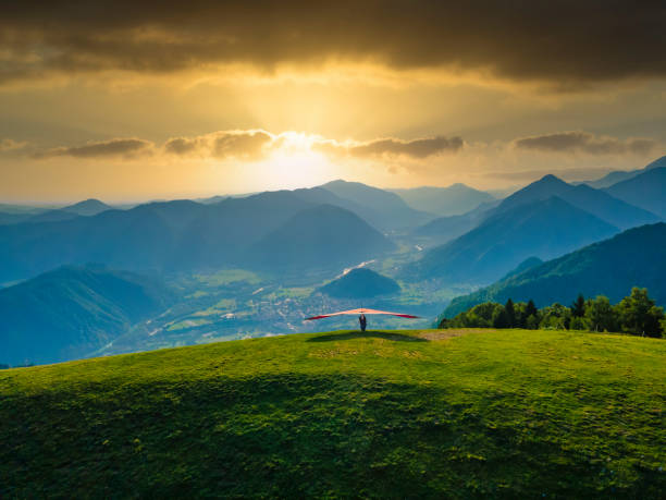istock Hang glider ready to launch from the green meadow in the mountains 1465272292