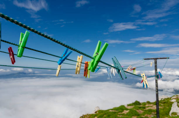 Colorful clothespins on the rope high in the mountains. Alpine laundry.