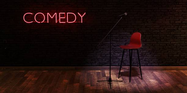 istock stage with microphone and stool with red neon lamp with the word COMEDY. space for text 1465272937