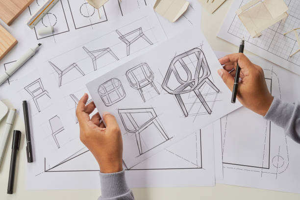 istock Designer sketching drawing design development product plan draft chair armchair Wingback Interior furniture prototype manufacturing production. designer studio concept . 1465276264