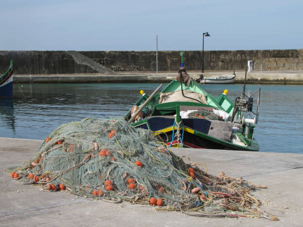 istock fishing boat in the harbor 1465276660