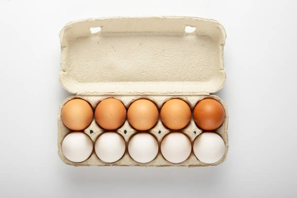 istock Raw chicken eggs in an egg tray on a white background. 1465279804