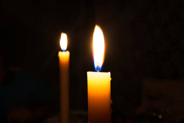 istock Two candles lighting the the dark night after power cut 1465285077