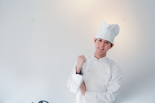 Male chef posing with his guts