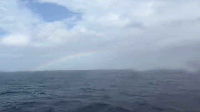 Strait of Gibralter, stormy sea, rainbow
