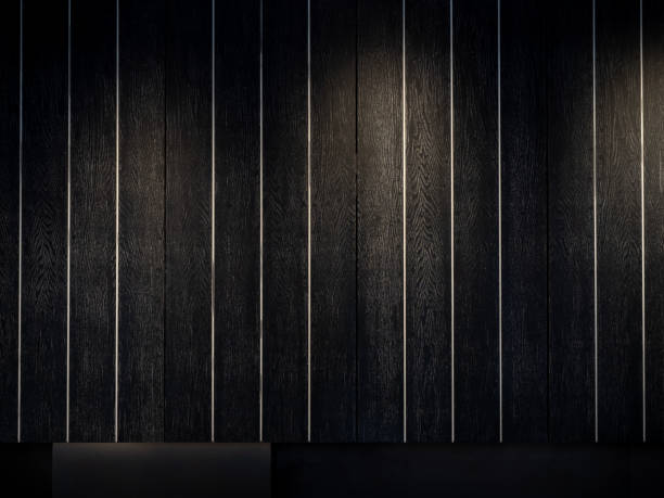 istock Black wood texture background, vertical style. Dark wooden plank wall striped pattern decoration in dark room with the lighting from spotlight. 1465290830