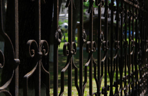 istock Black metal fence with monograms. 1465291114