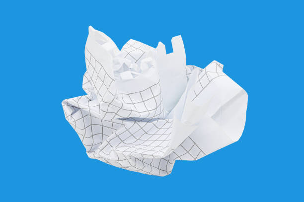 istock Crumpled notebook sheet in a cage isolated on blue background 1465292243